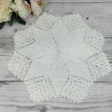 Handmade round placemat in crocheted cotton lace