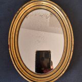 Old golden oval mirror