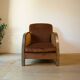 Art Deco club armchair in wood and rust brown velvet, circa 1930.