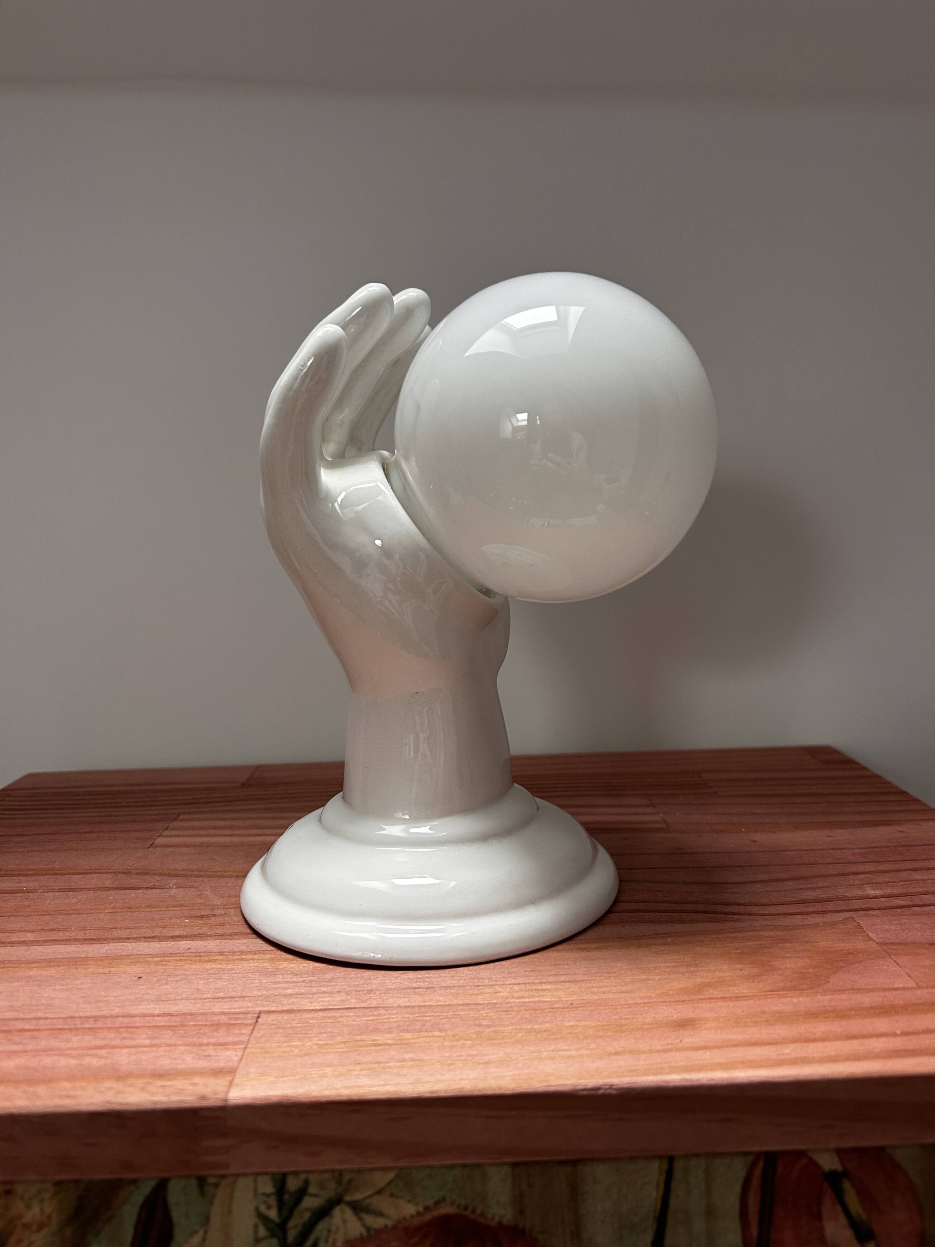Ceramic hand wall light