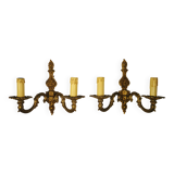 Pair of two-light wall lights in gilded bronze