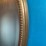 Vintage beveled gold oval mirror
