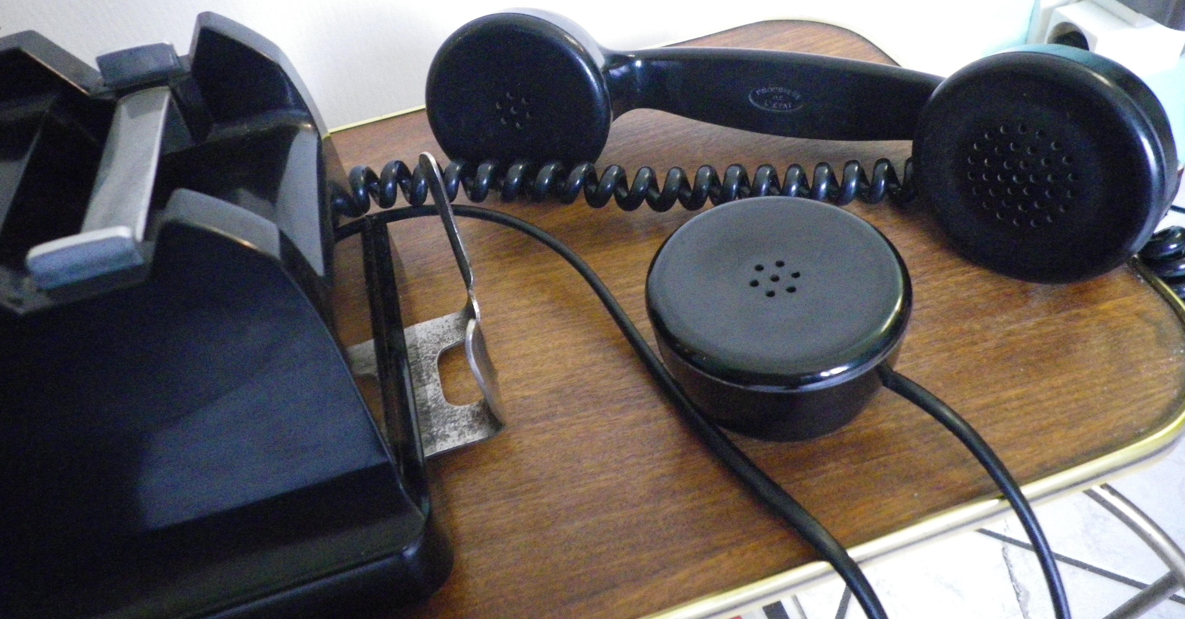 Black bakelite phone with earphone