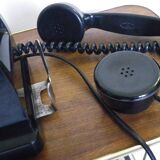 Black bakelite phone with earphone