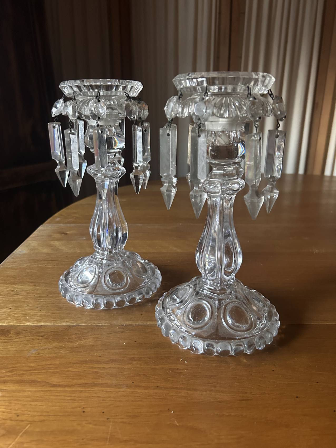 Pair of large Baccarat crystal candlesticks with pendants, a rare choice.