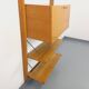 Wall shelf library with vintage light wood secretary bar