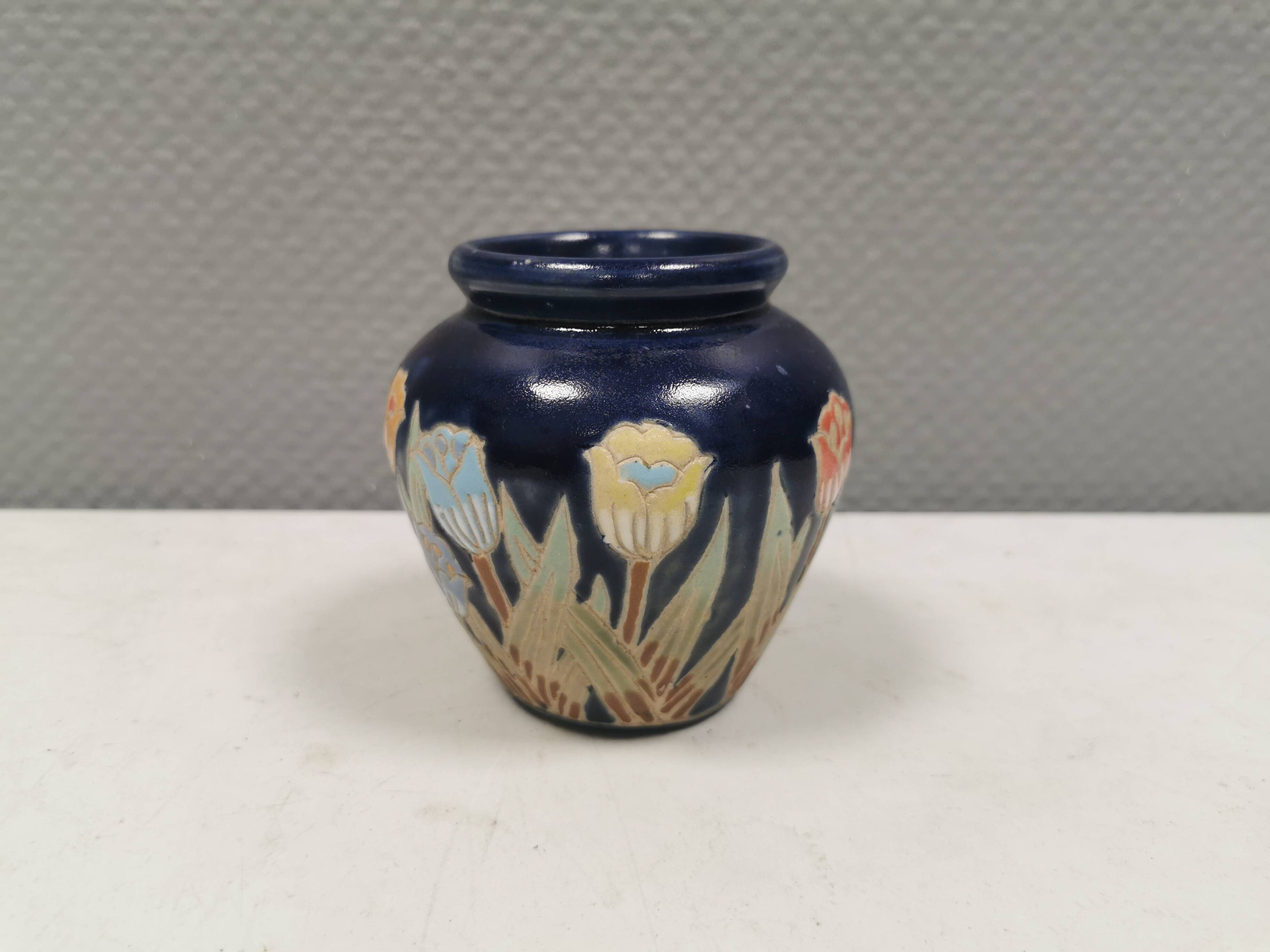 Small delicious blue ceramic vase with floral decoration. Sweden 1970s