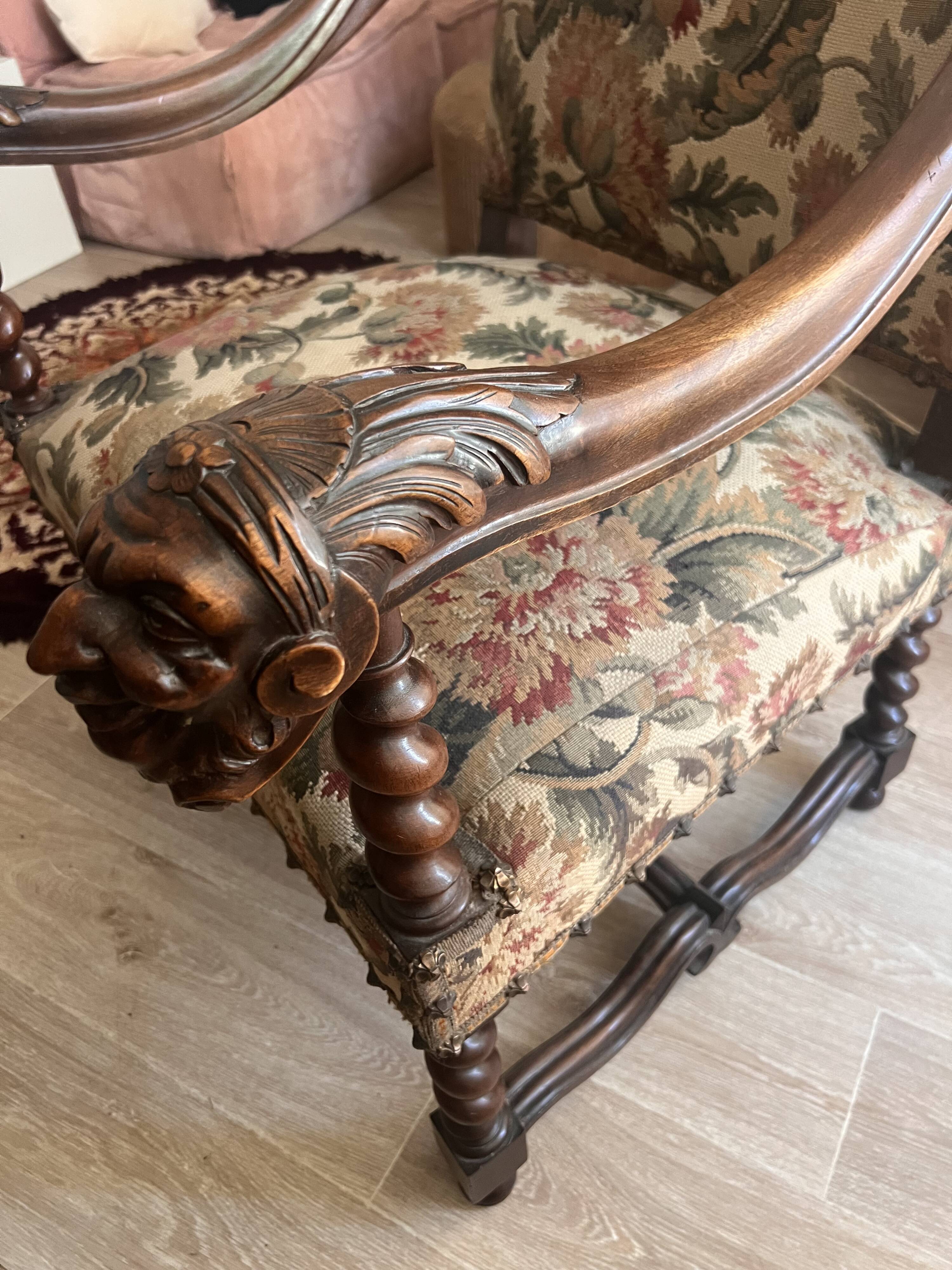 Antique armchair in Henri II style with masks