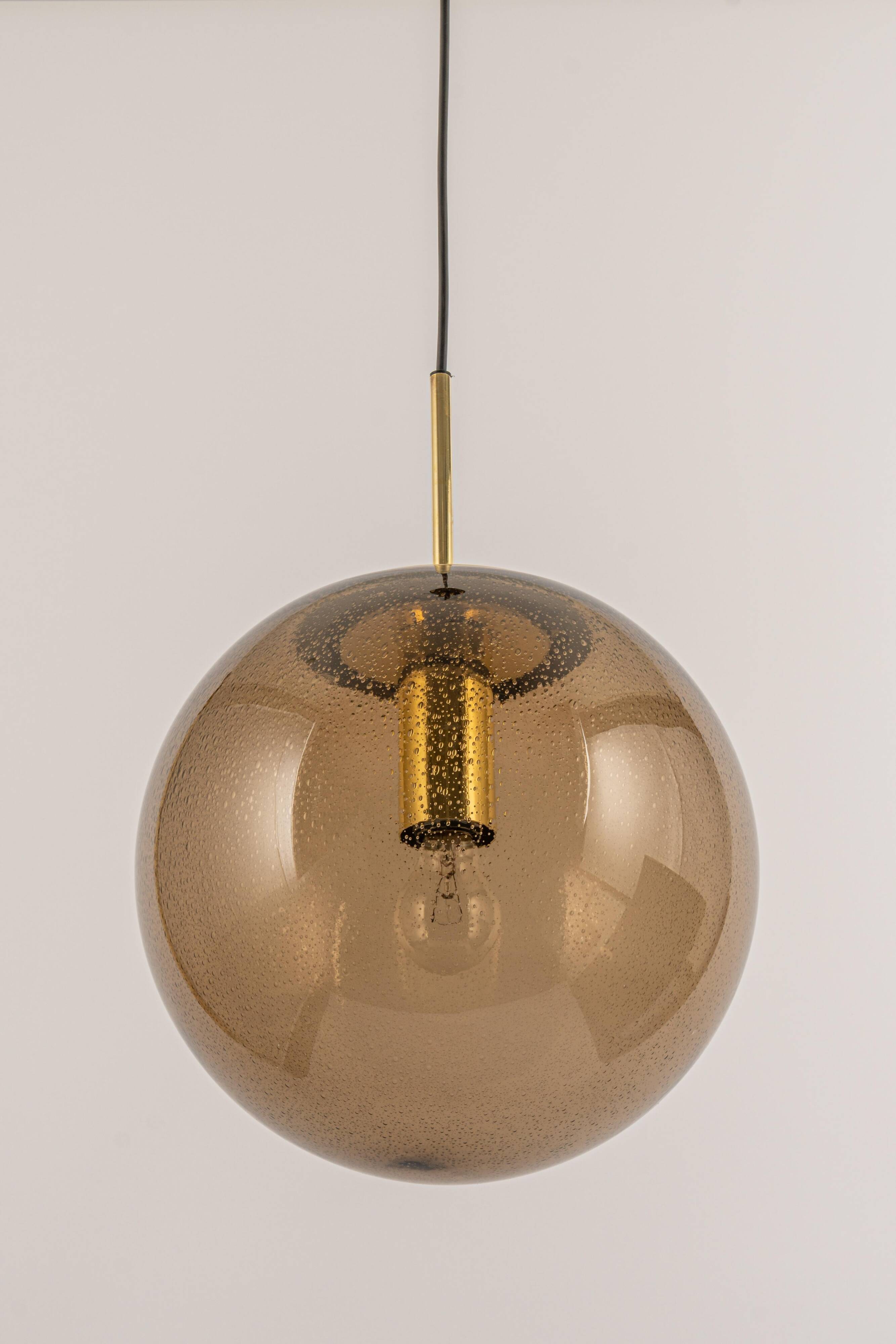 Large smoked glass ball pendant by Limburg with brass, Germany, 1970s.