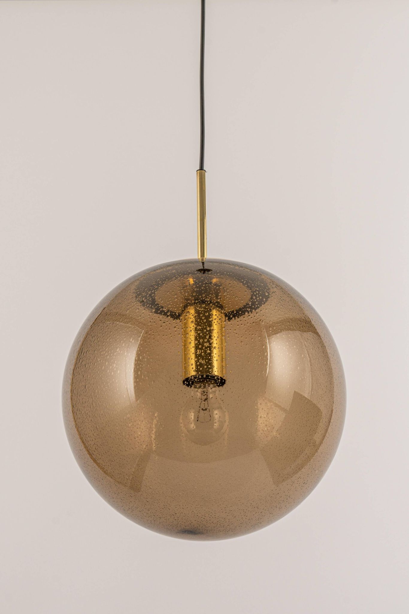 Large smoked glass ball pendant by Limburg with brass, Germany, 1970s.