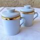 2 white and gold Limoges porcelain tea cups