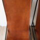 Pair of vintage armchairs in stretched leather and metal structure