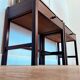 Pair of walnut bedside tables designed by Jacques Hauville for Roche Bobois.