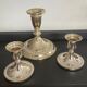 Series of 3 vintage candle holders in silver metal 70s