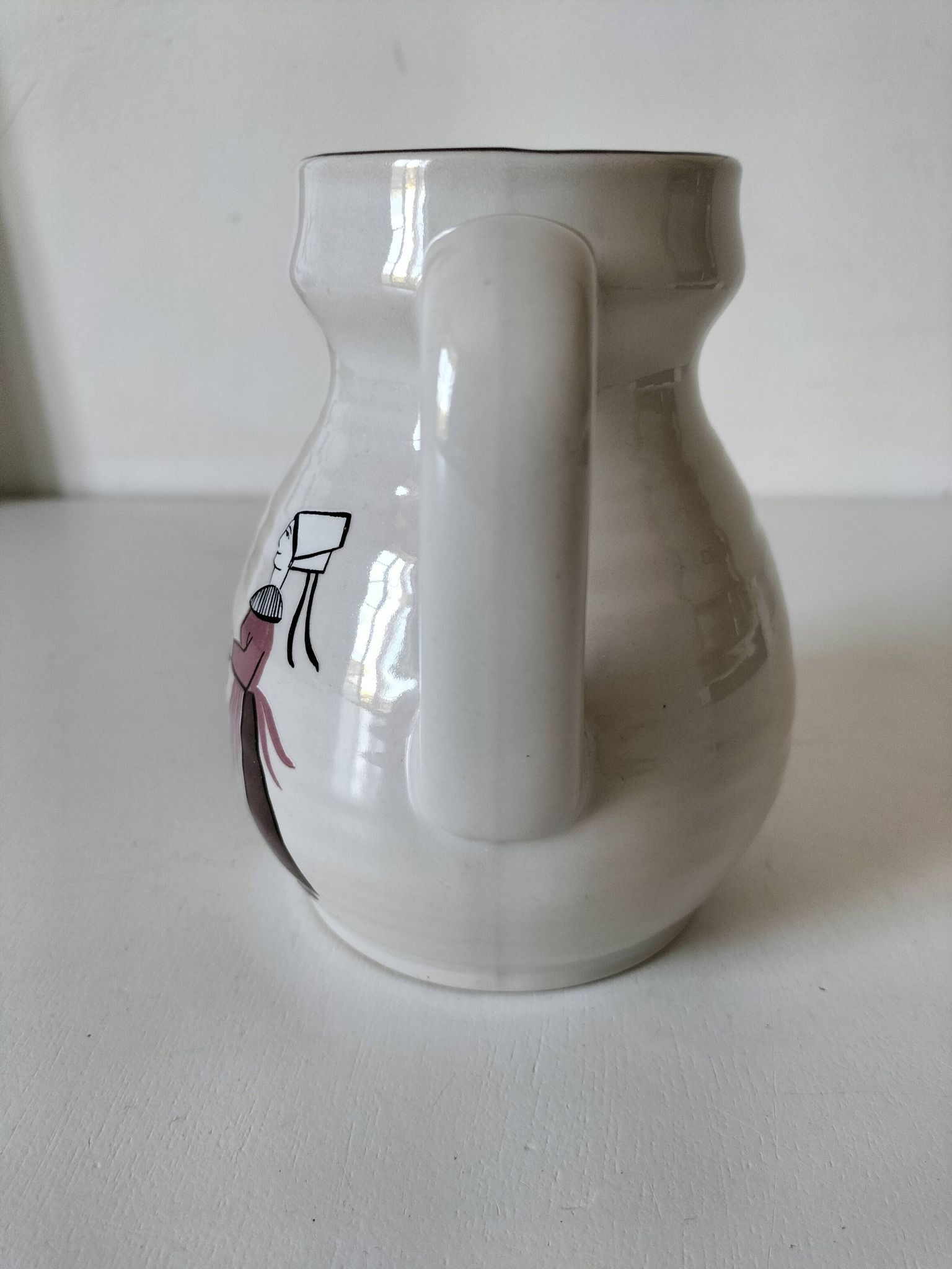 Ceramic pitcher from Quimper, created by Dominique Villard.