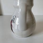 Ceramic pitcher from Quimper, created by Dominique Villard.