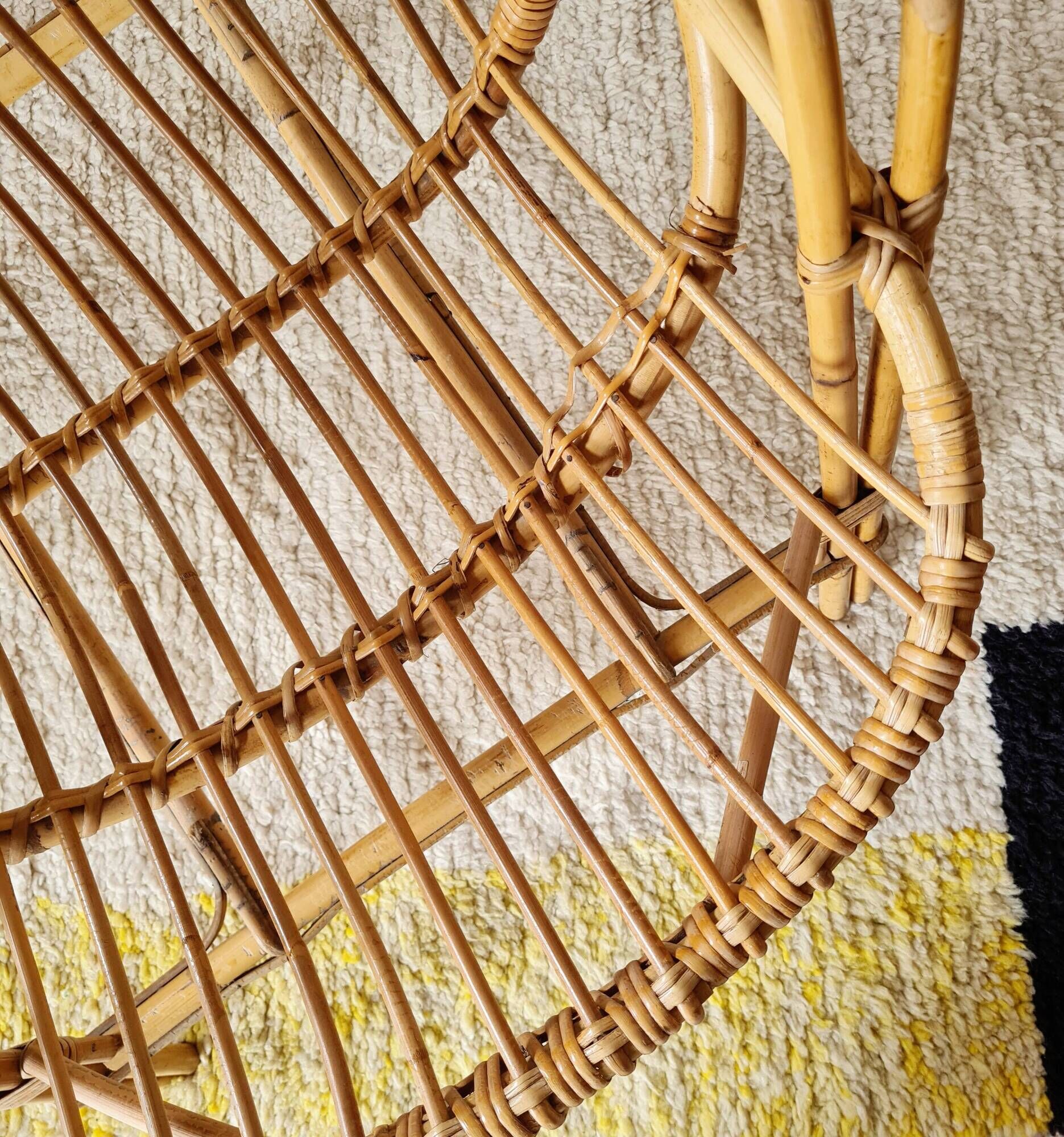 Vintage adult rattan armchair from the 1960s.