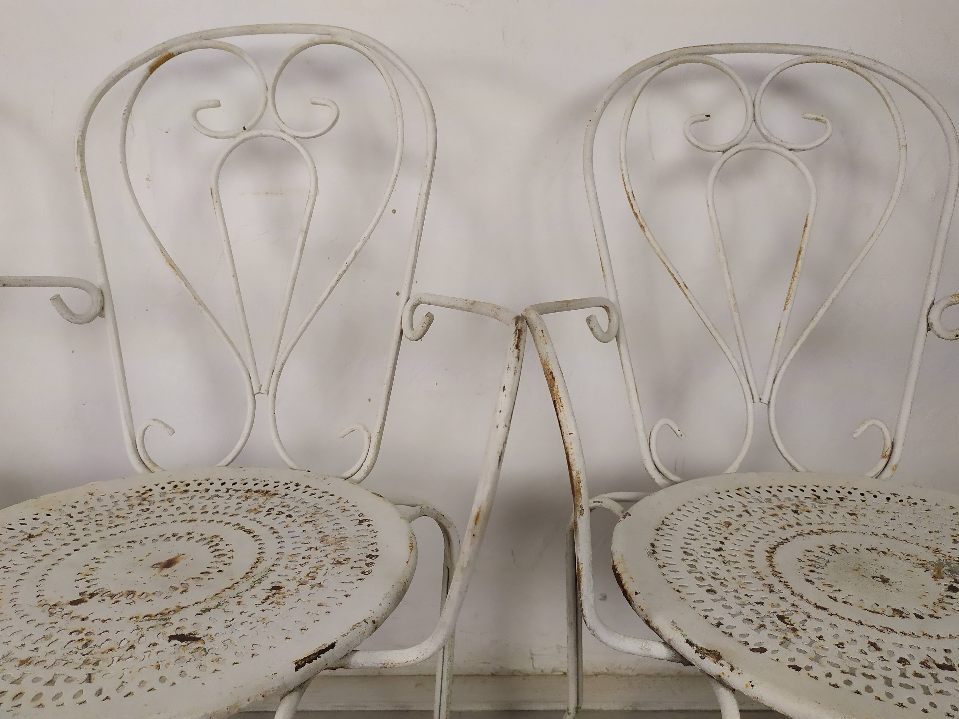 4 wrought iron garden armchairs