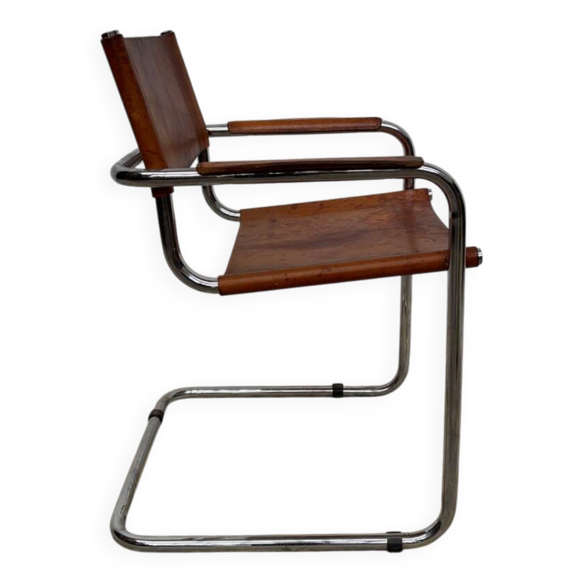 Vintage aluminum tube and tan leather armchair
