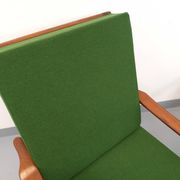 Pair of vintage Scandinavian armchairs in teak and green fabric from the 1960s.