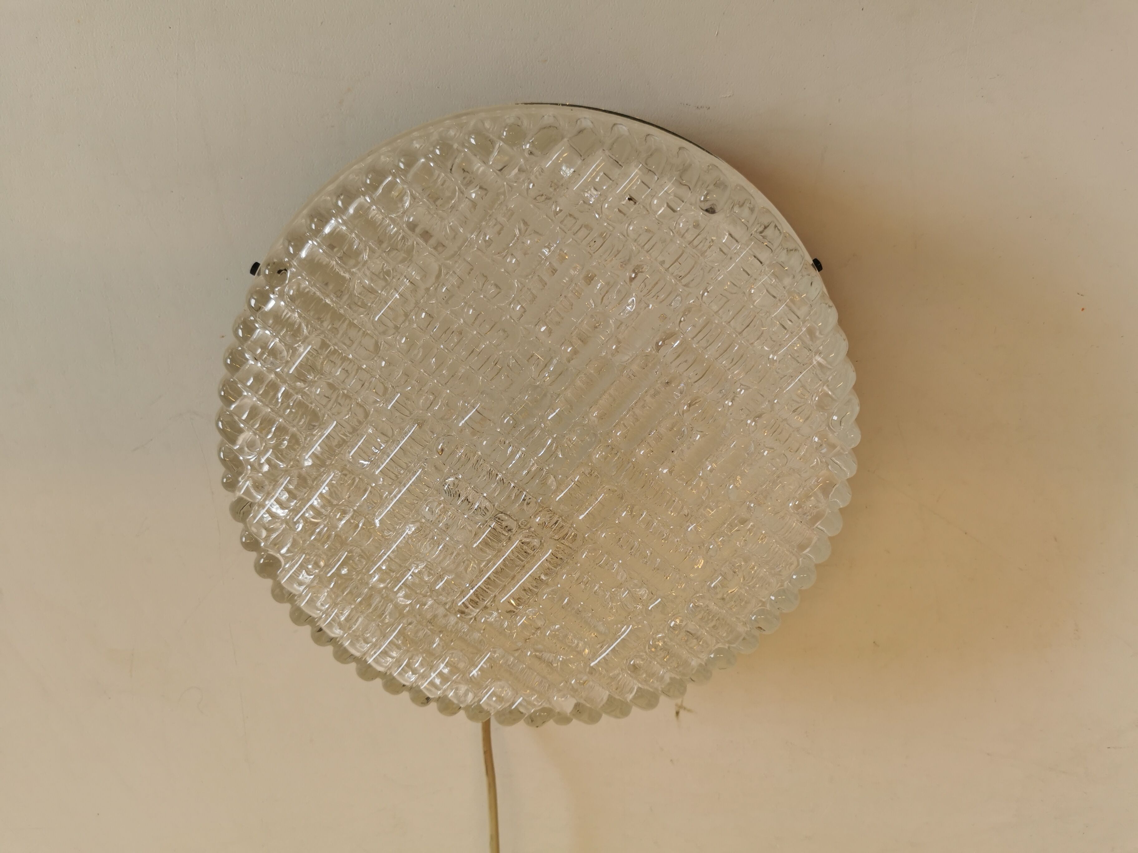 Ceiling light, in dark metallic paint with thick glass shade with beautiful details in the glass.