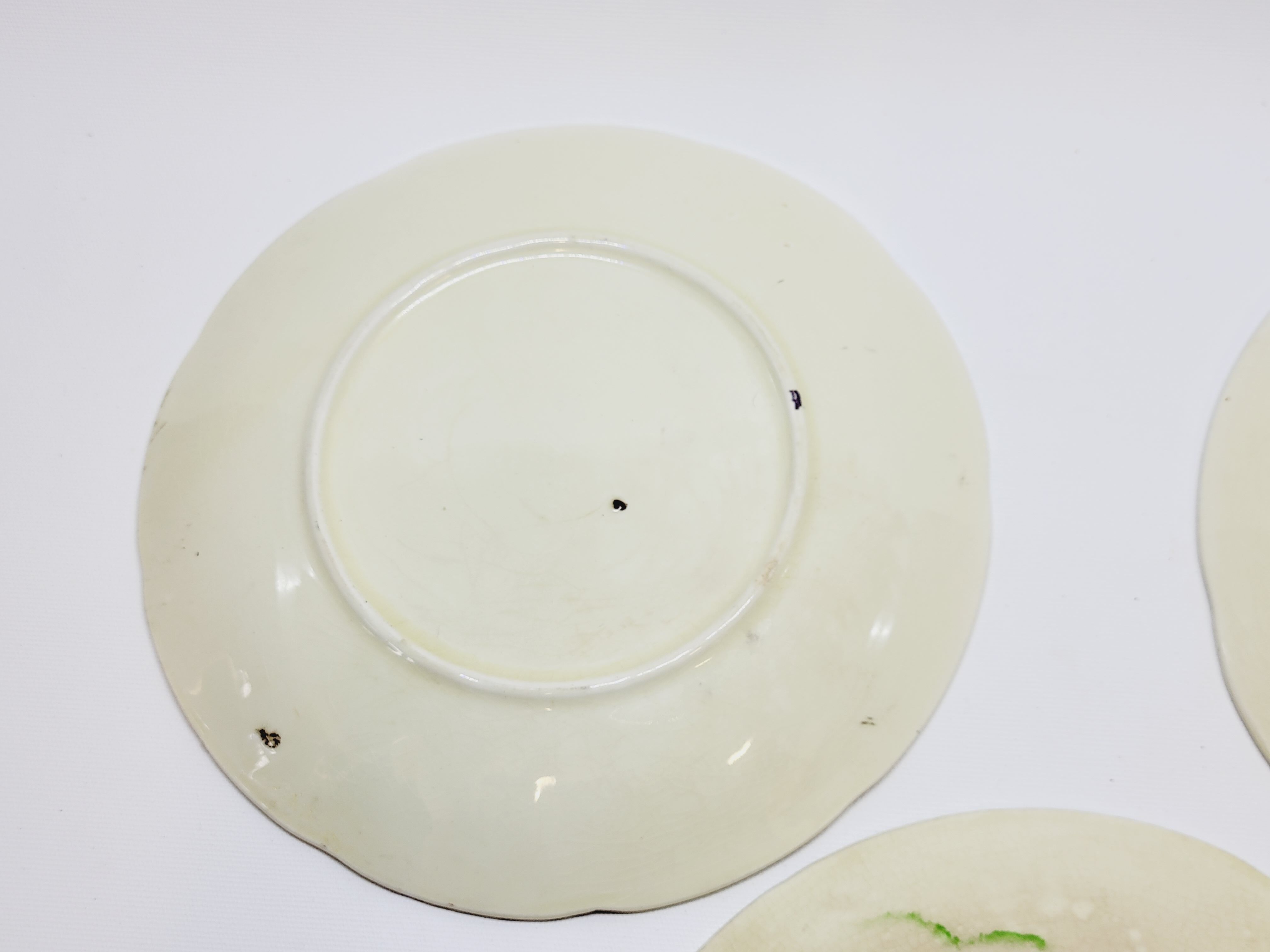 3 old plates in slip decoration strawberries and grapes