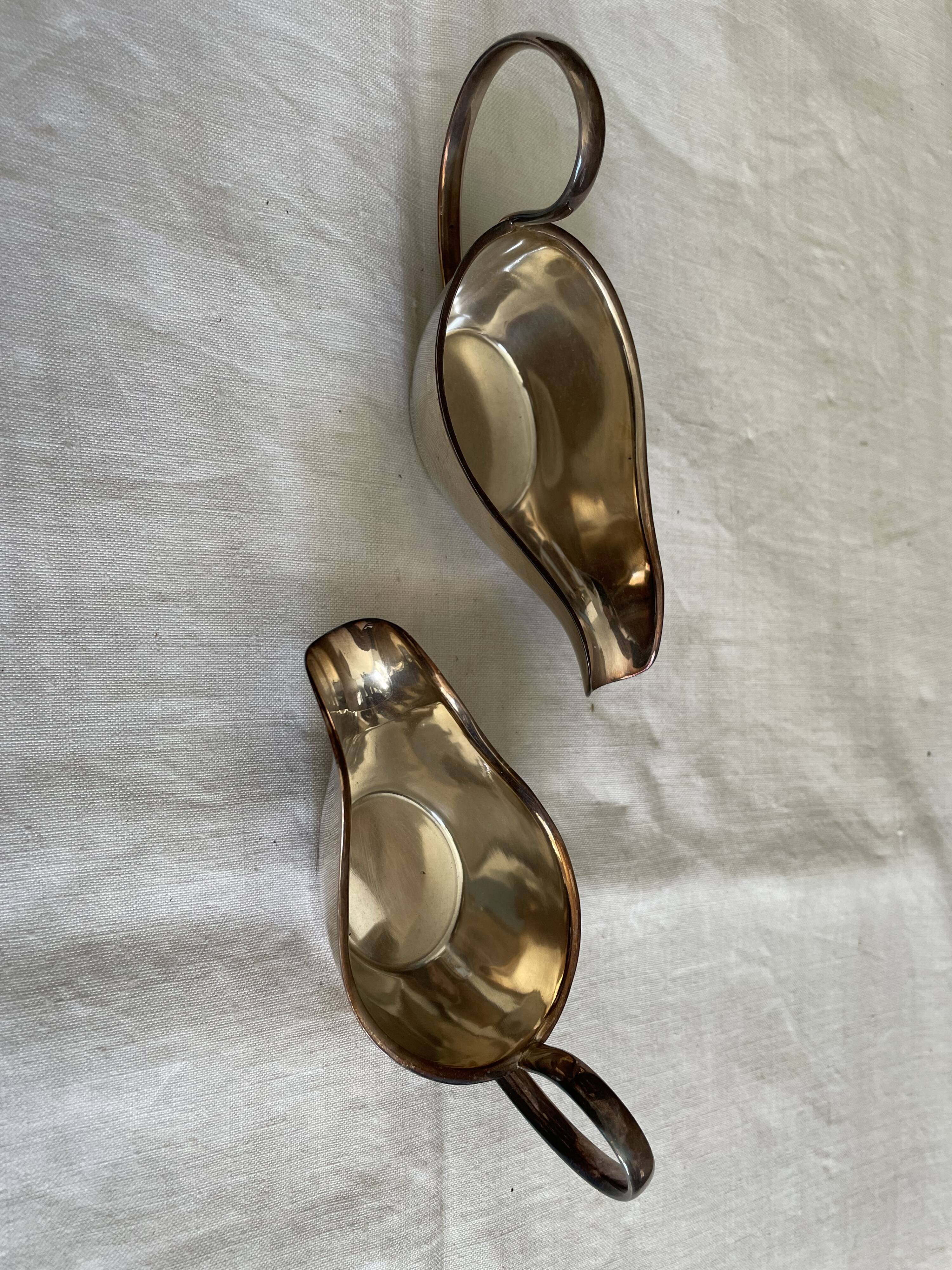 Set of two silver metal saucepans