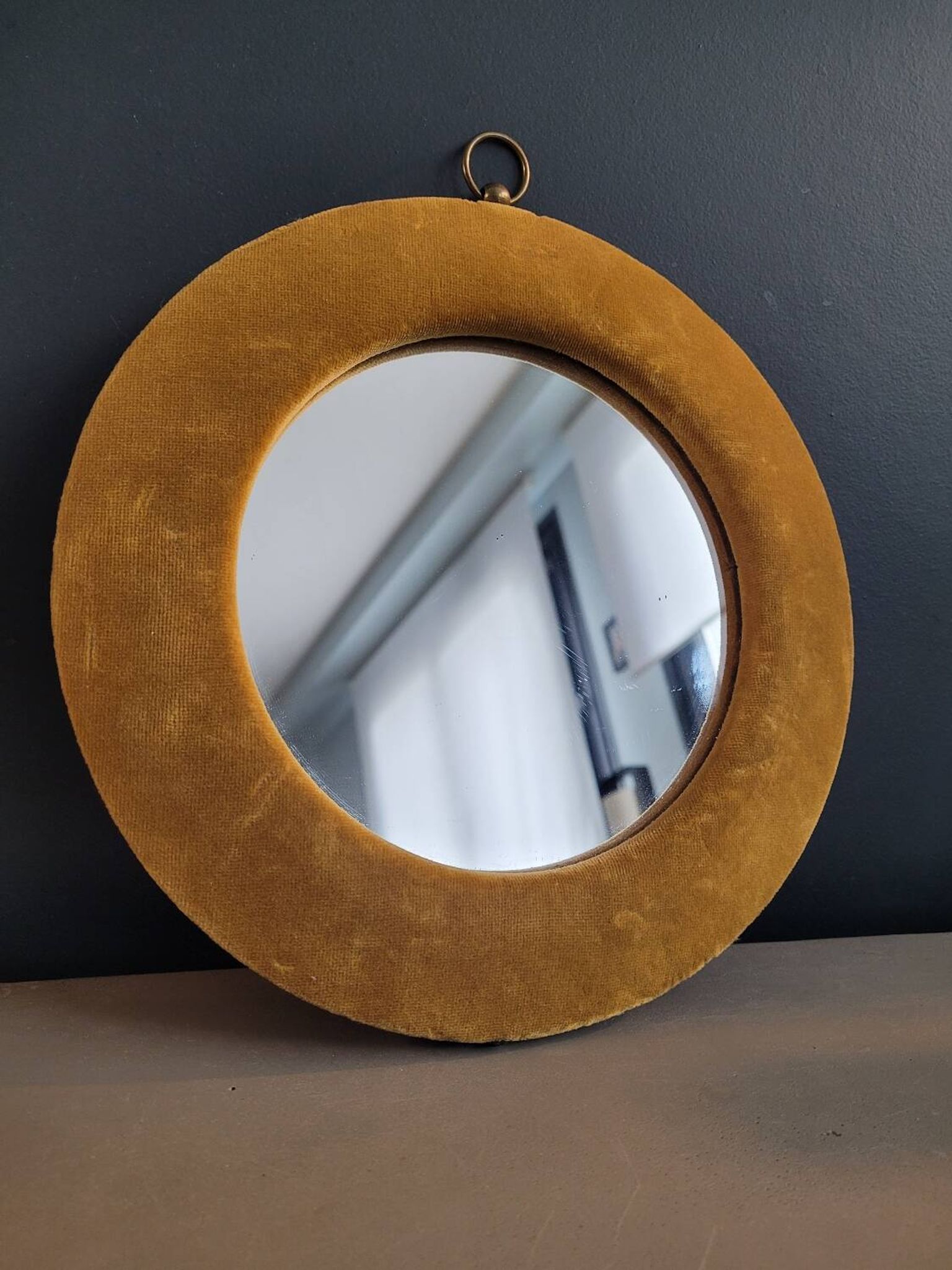 Vintage mirror with mustard velvet frame