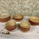 Lot of vintage Gien stoneware from France, 14 pieces including bowls and salad plates.