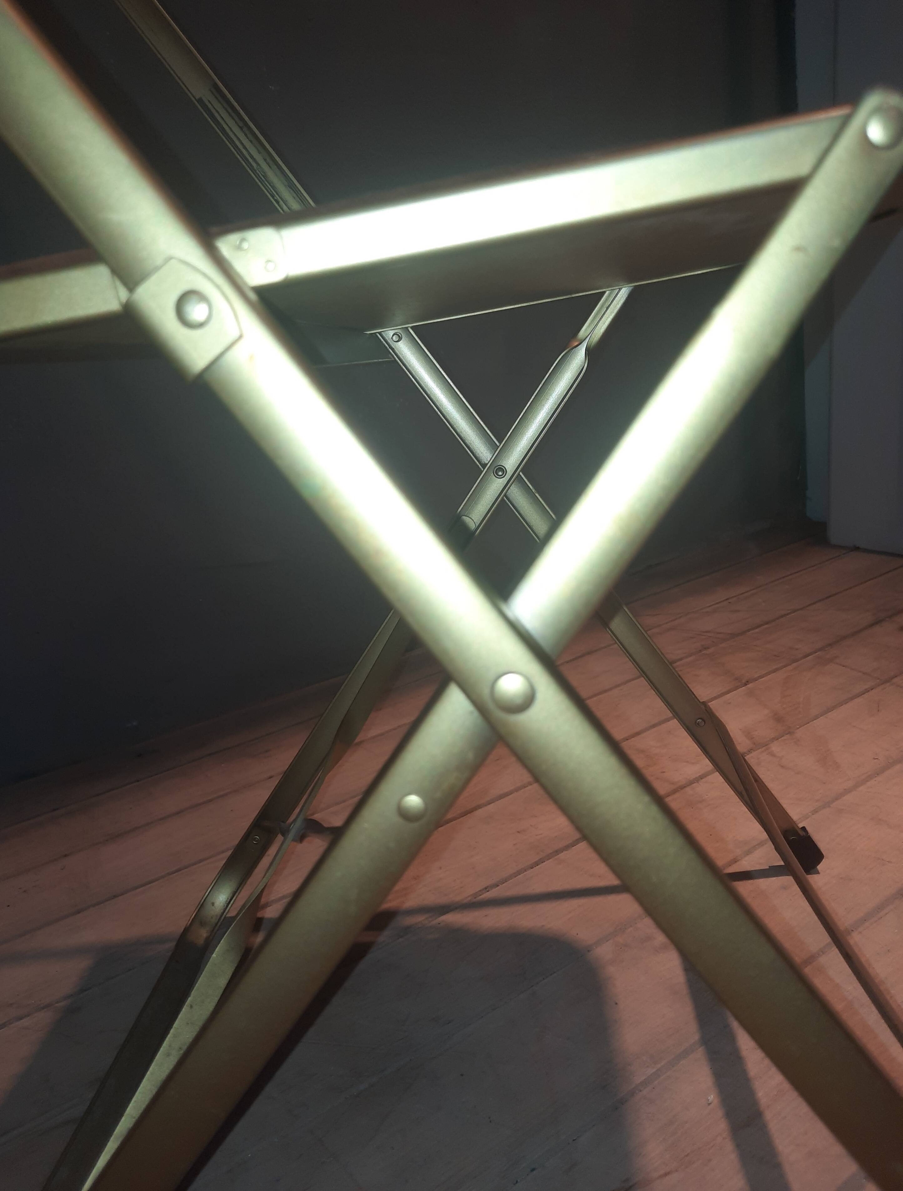 Set of four folding metal and velvet chairs