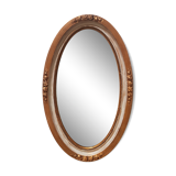 Large oval mirror with bevelled ice in stucque and wood decorated with flowers