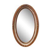 Large oval mirror with bevelled ice in stucque and wood decorated with flowers