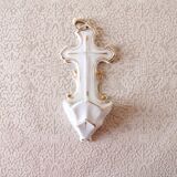Antique holy water font in white porcelain biscuit.