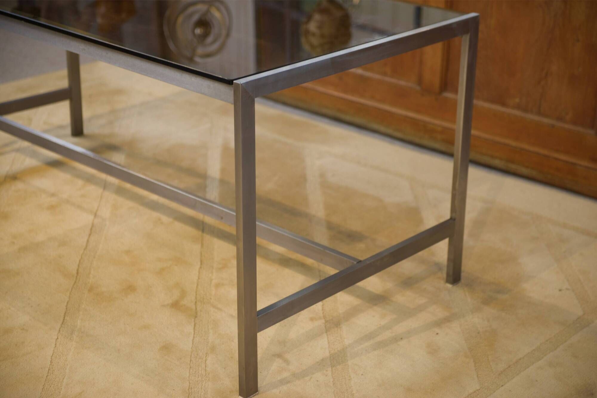 Brushed stainless steel and smoked black glass desk from the 1980s.