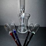 Set of 5 vintage colored glass champagne flutes gathered in a bouquet in a vase