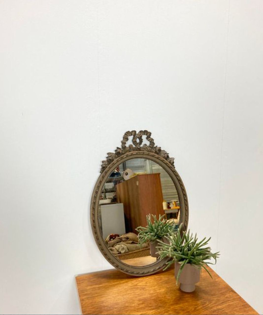 Vintage wooden mirror with arch and flowers