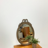Vintage wooden mirror with arch and flowers