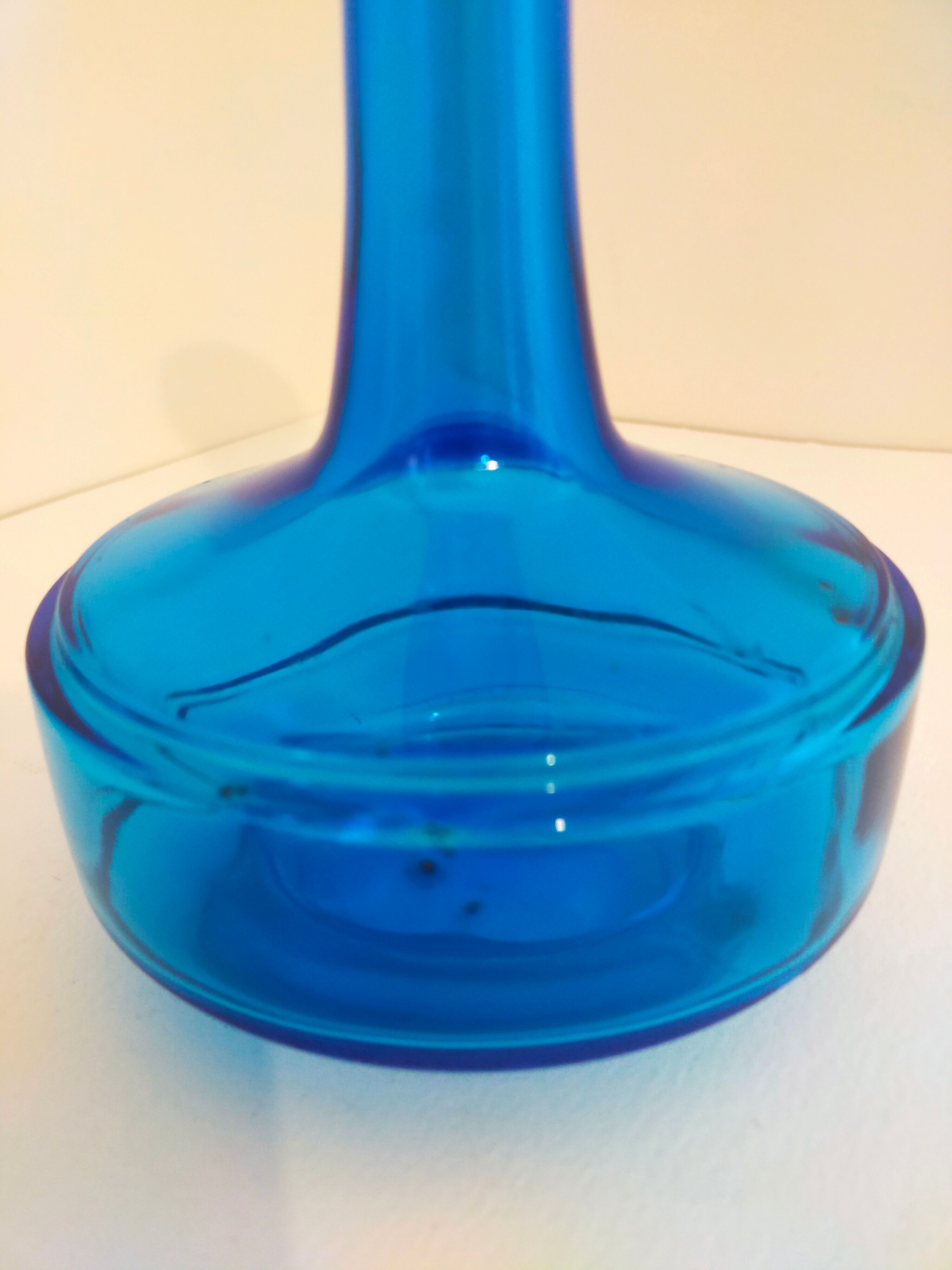 Bottle of old perfume of blue color