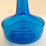 Bottle of old perfume of blue color
