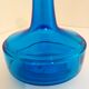 Bottle of old perfume of blue color