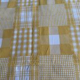 Vintage rectangular reversible cotton tablecloth with yellow and white Vichy checks and squares.