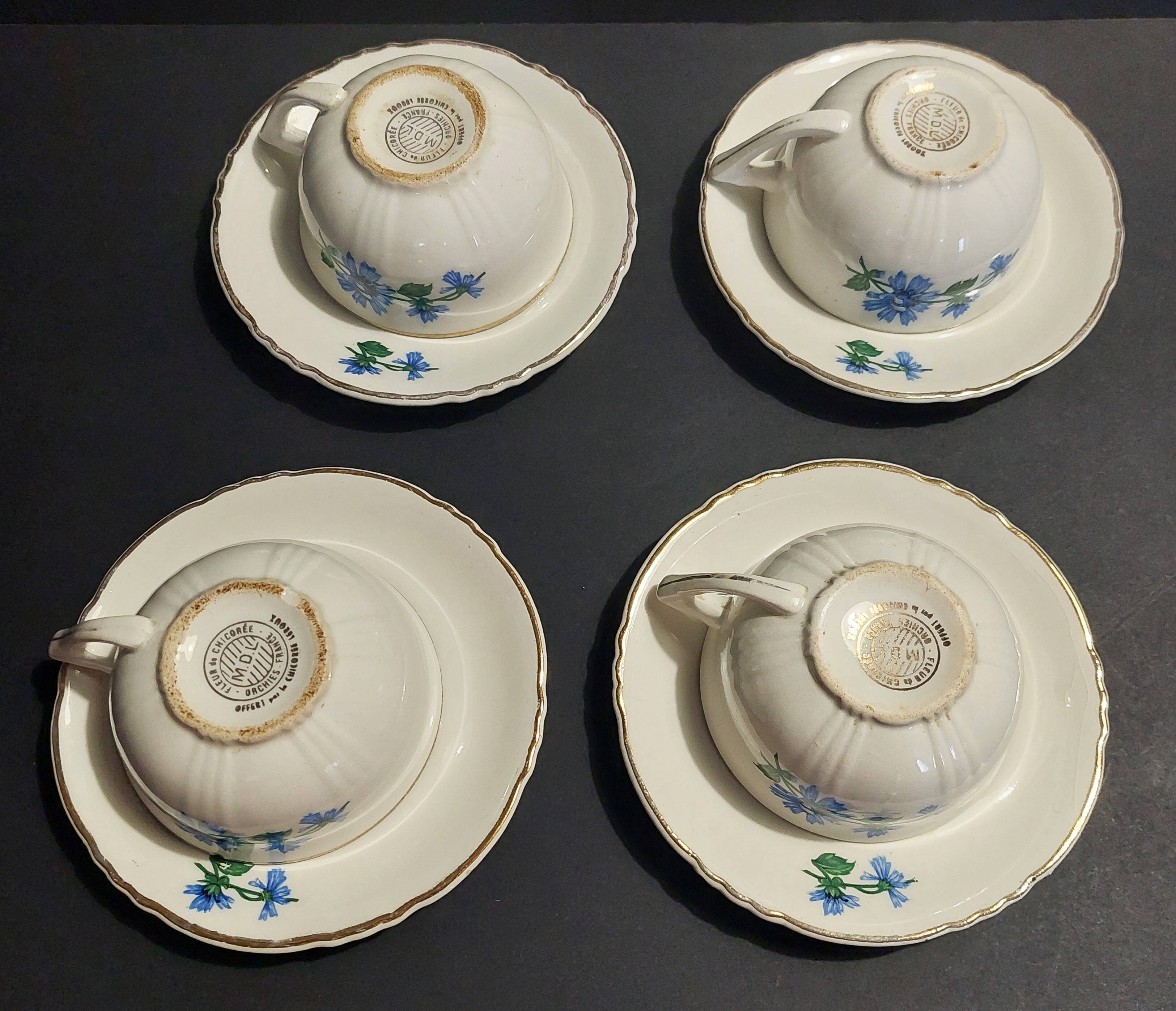 Series of four Orchies earthenware cups with chicory flower decoration