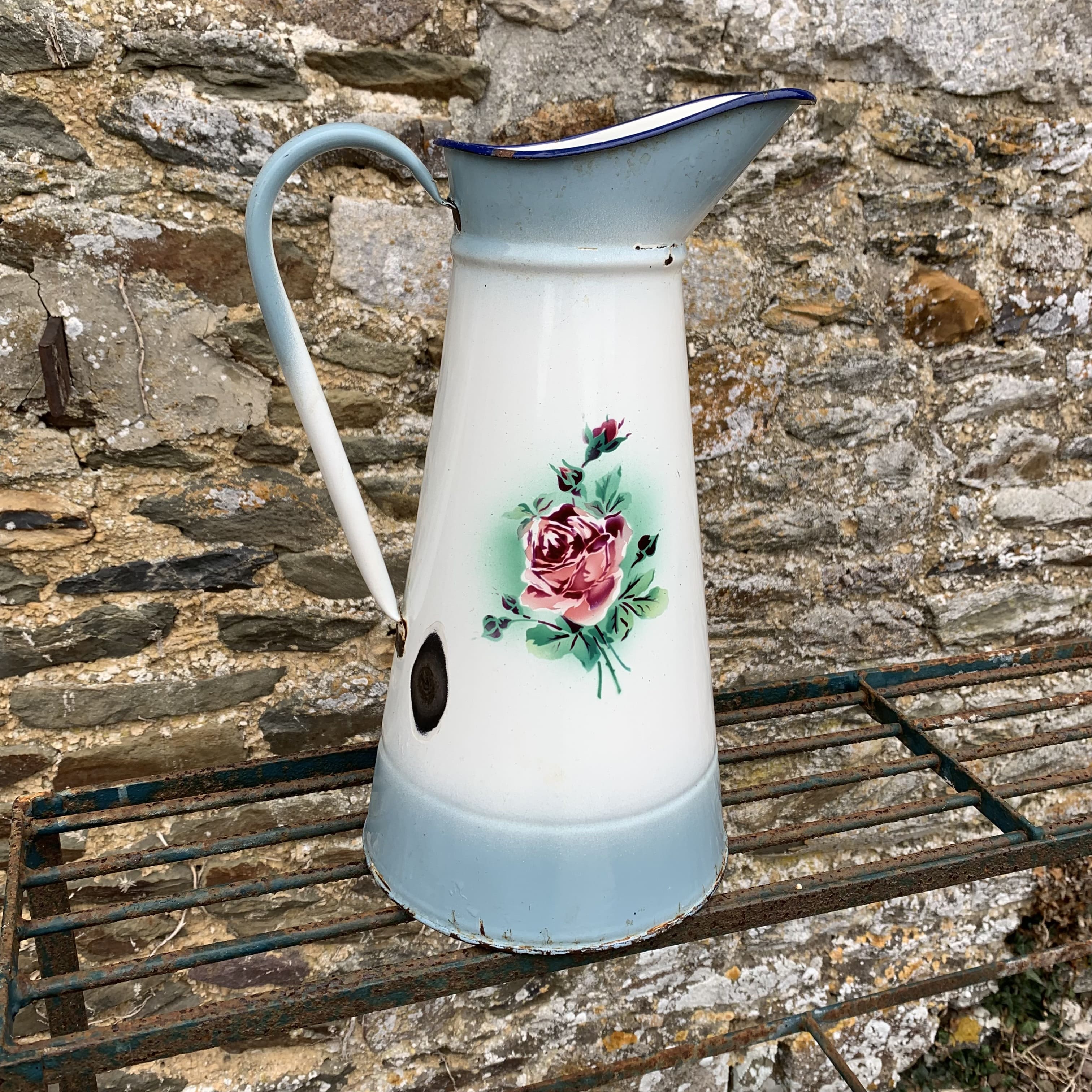 Enamelled broc with floral decoration