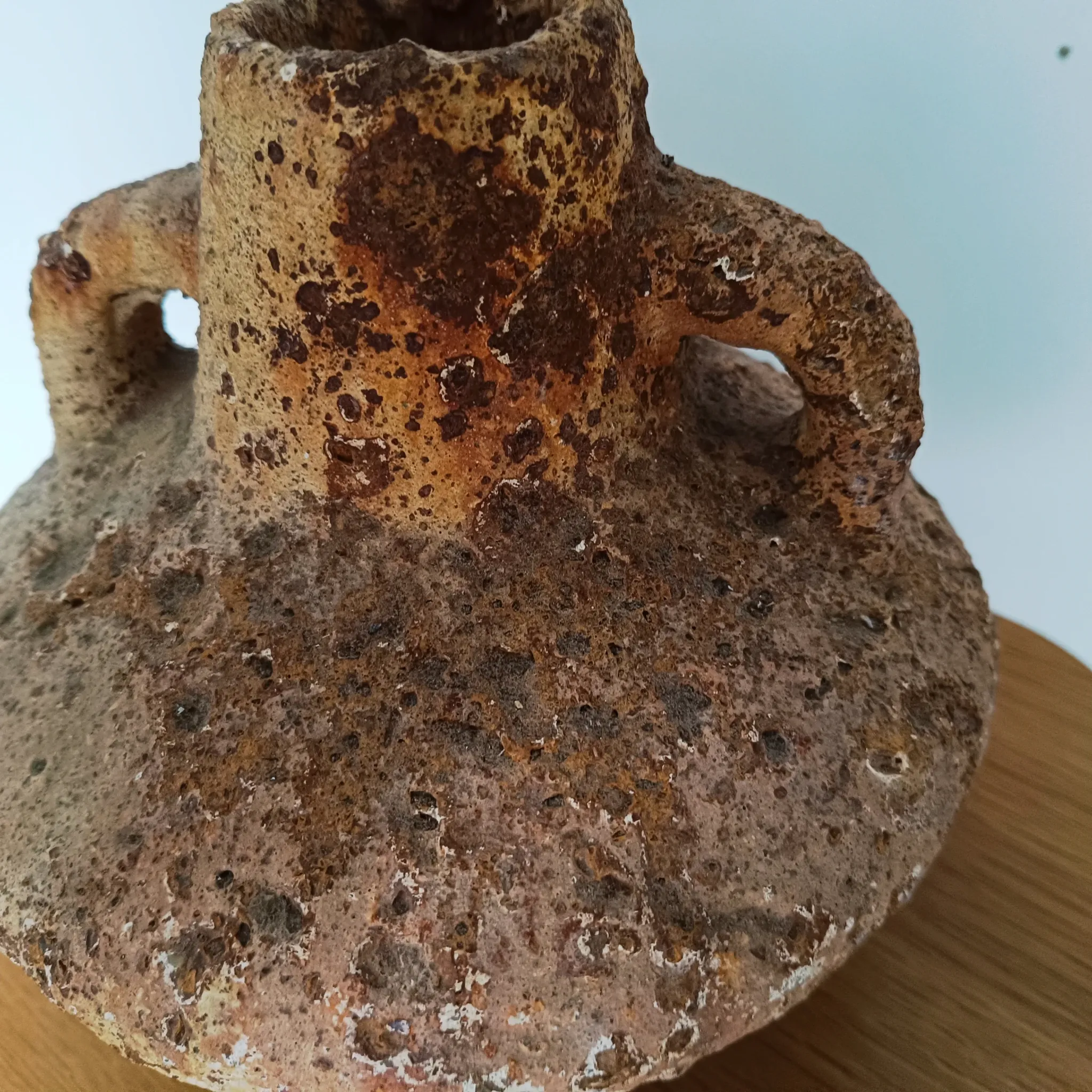 Textured terracotta vase in wabi-sabi style