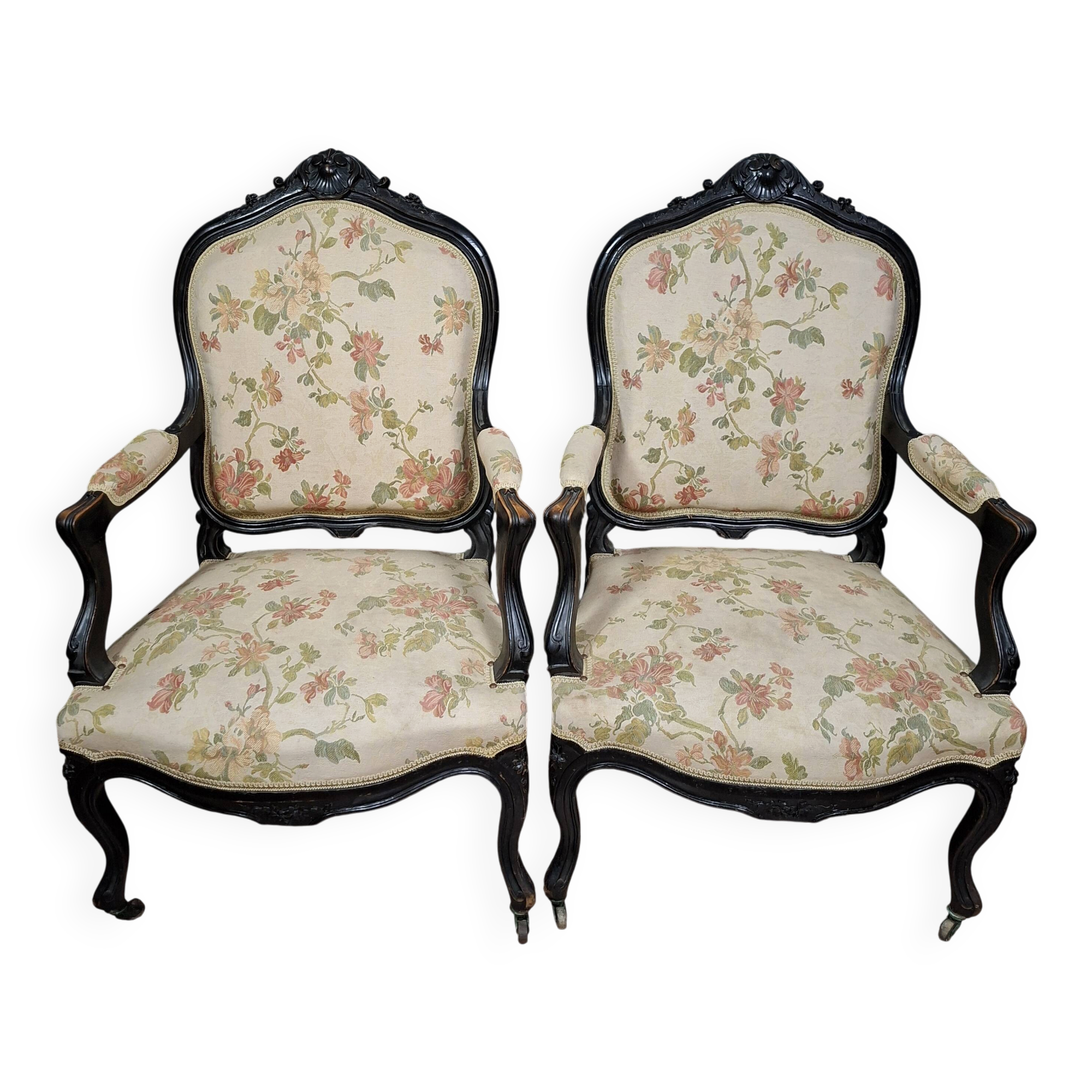 pair of Louis XV style armchairs, in moulded and carved wood, lacquered black