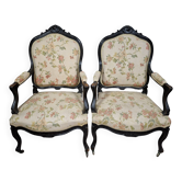 pair of Louis XV style armchairs, in moulded and carved wood, lacquered black