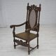 Fauteuil danois à haut dossier des années 1930, en maille, velours et bois de chêne sculpté.