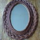 Vintage oval wicker mirror