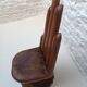 Sculpted wooden chair in the shape of a hand, 1960.