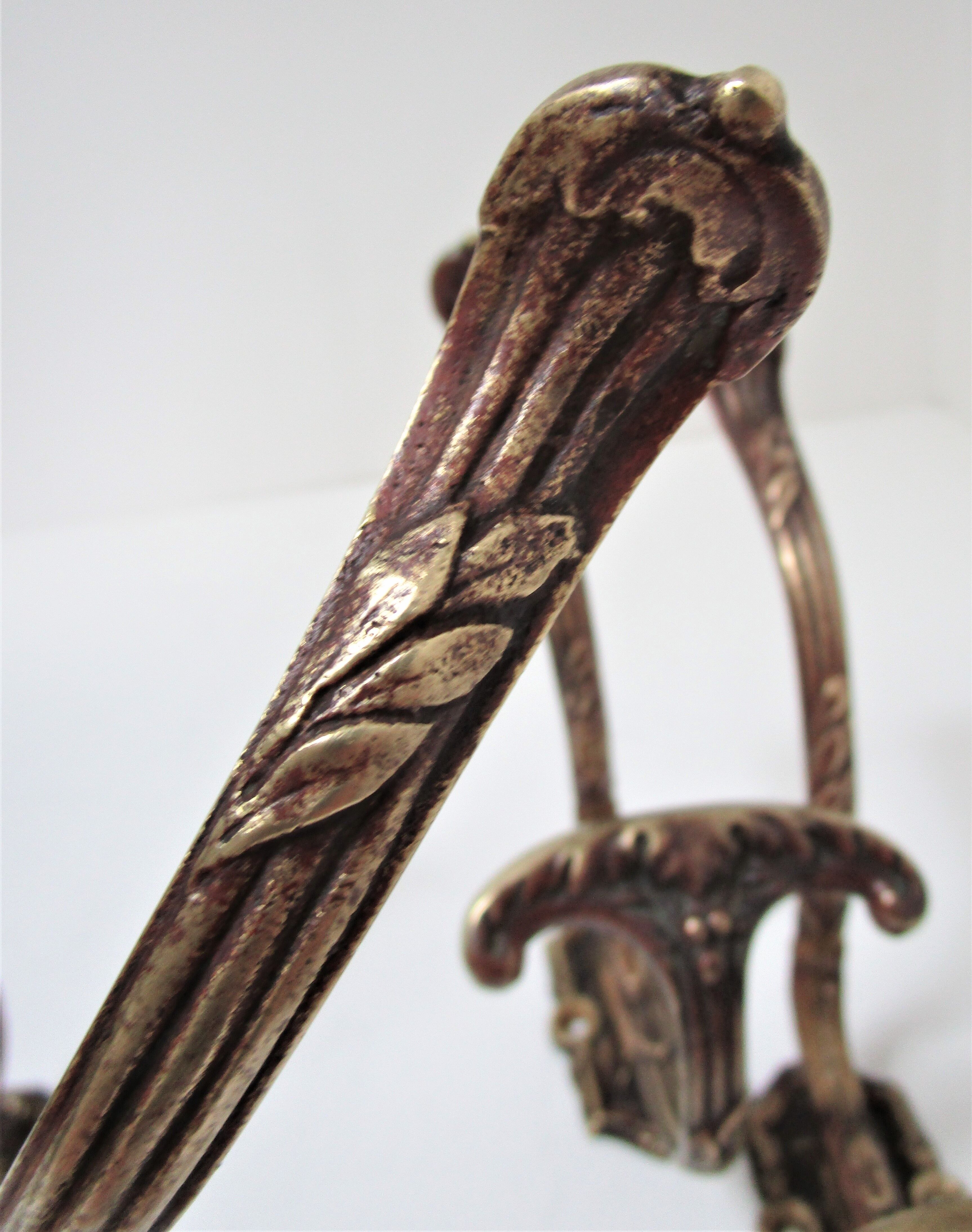 Four patères bronze patinated leafy décor early 20th century